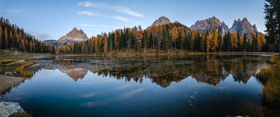 A still lake mirroring the Three Peaks of Lavaredo